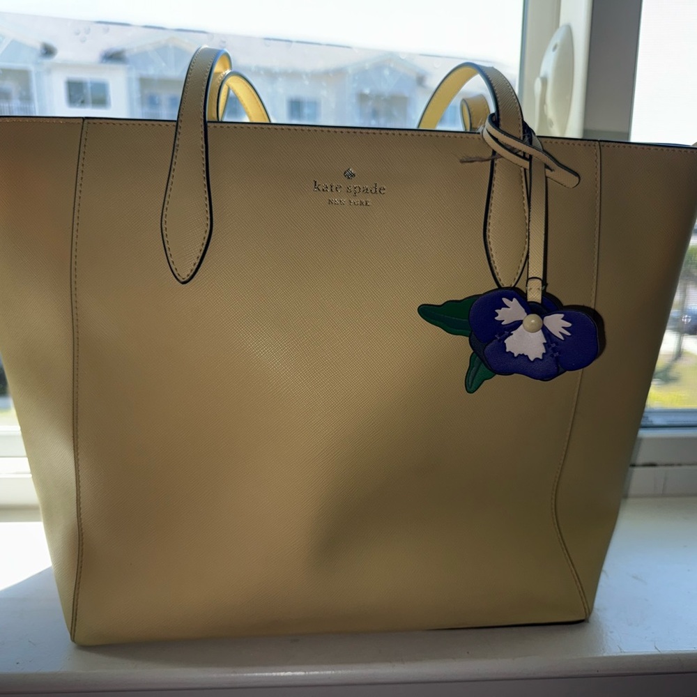 Kate Spade New York Light Yellow Dana Tote with Purple Floral Pansy Charm